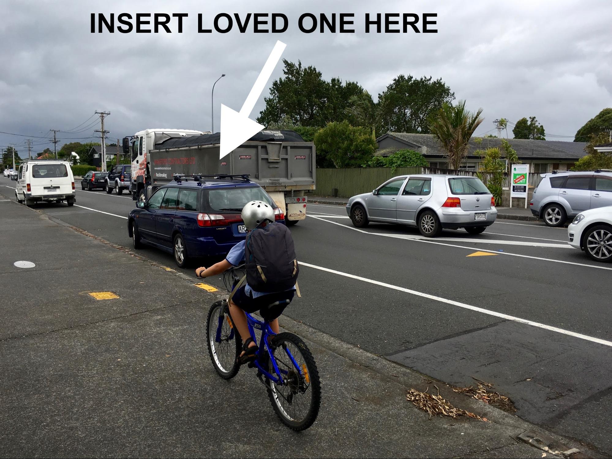 Older child on bike on footpath, with truck on road and "insert loved one here" arrow pointing to the road next to the truck
