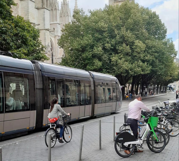 A tram, bicycles, and bollards in Bordeaux